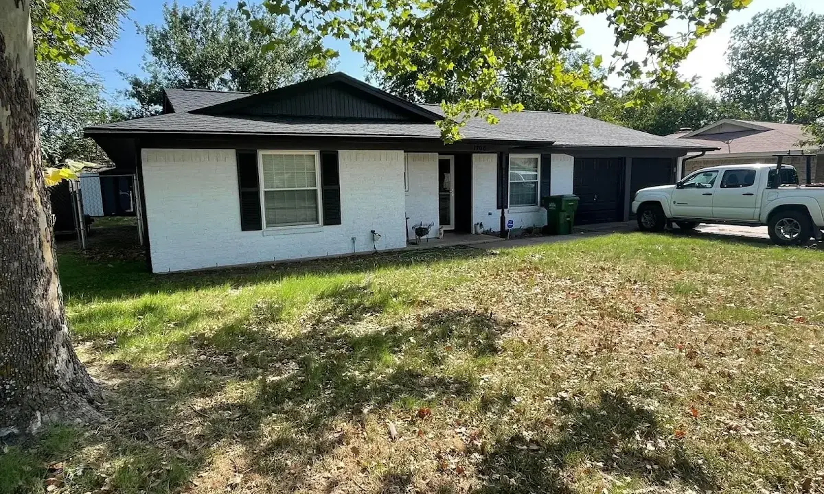 Professional roofing crew working on a residential roof in Champaign